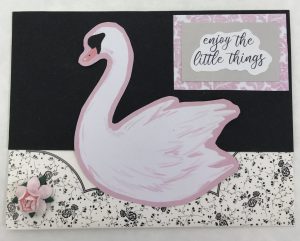 Image of hand constructed greeting card says enjoy the little things with a pink swan